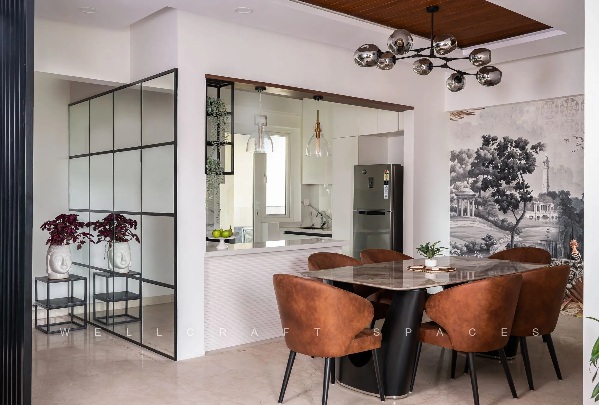 Dining room viewed through a mirrored and black-framed partition, showing the marble table, rust chairs and the mural wall beyond.